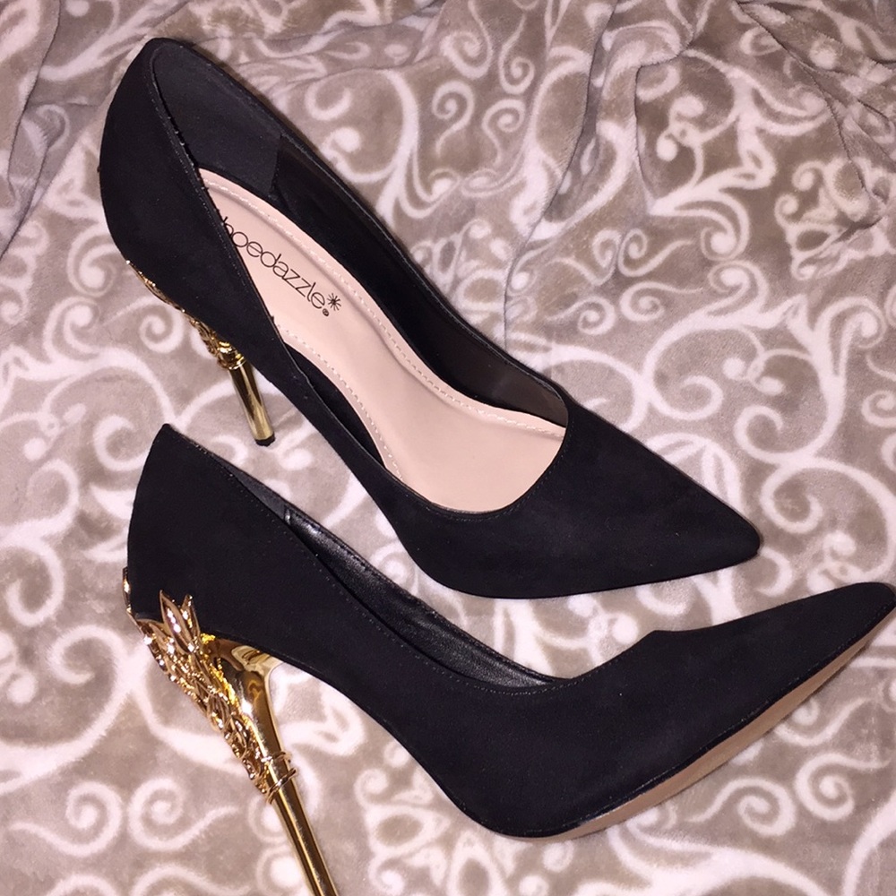 Black and gold pumps